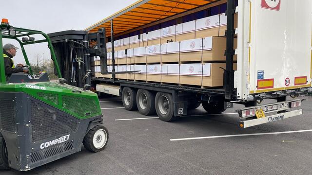 Pallets being loaded onto a URS Choices trailer by forklift